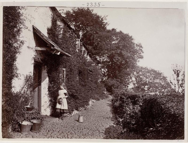 Girl at Cottage Doorway