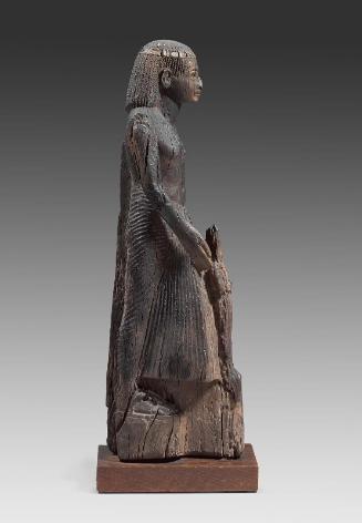 Dignitary holding a statue of Osiris