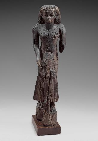 Dignitary holding a statue of Osiris