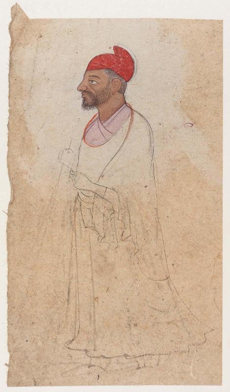 A man with red turban standing