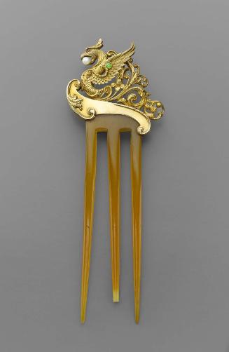 Hair comb featuring a profile dragon on a wave