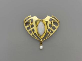 Sessionist-style brooch with a central, marquis-shaped opal