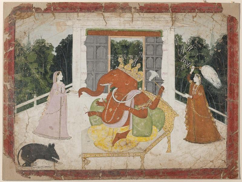 Ganesha with a book flanked by Riddhi and Siddhi