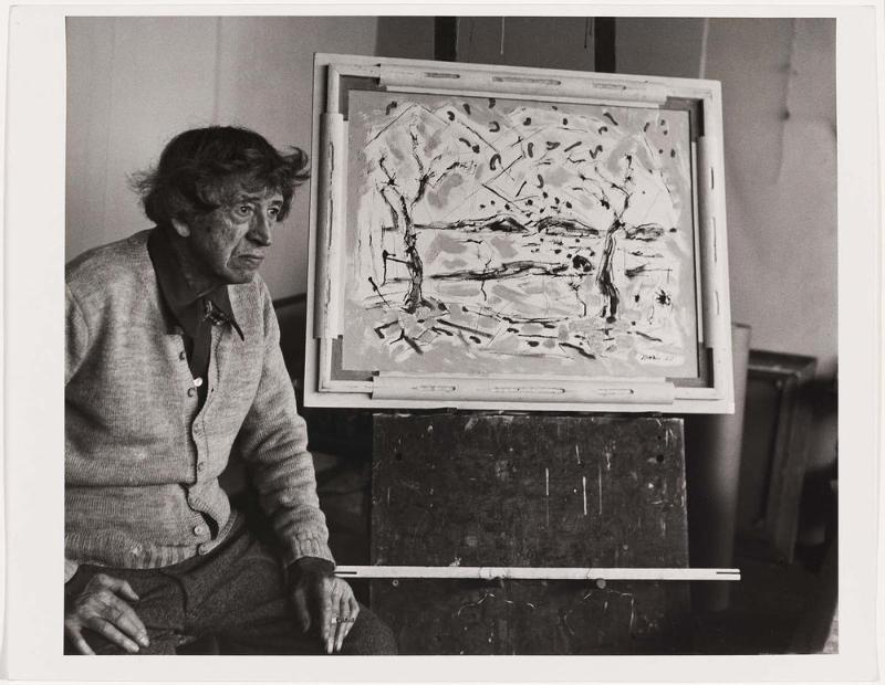 John Marin seated with his painting "Huntington, Long Island, #3"