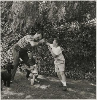 Untitled (Children playing with their father)