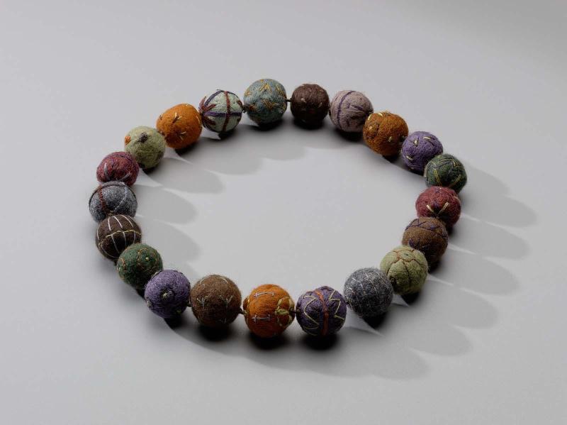 Felt-ball necklace with embroidery