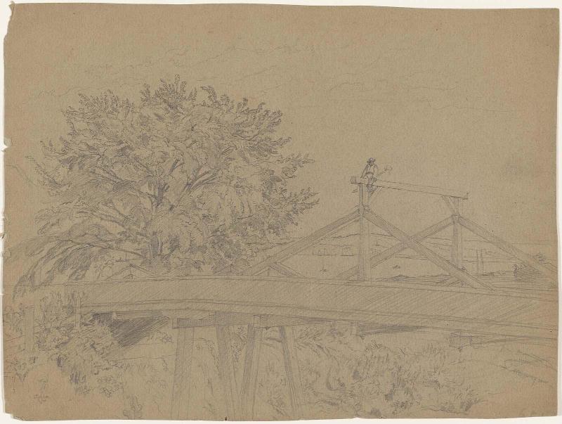 Bridge with man seated on crossbar