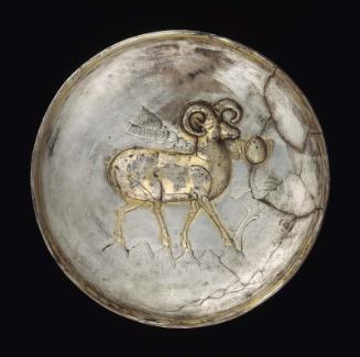 Plate with ram on a mountain top