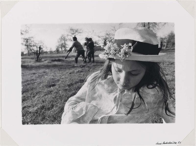 Girl in Hat with Flowers