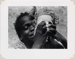 Untitled (Black Child Holding Doll's Head) from Few Comforts or Surprises