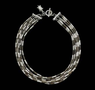 Necklace composed of mixed-metal, cylindrical beads