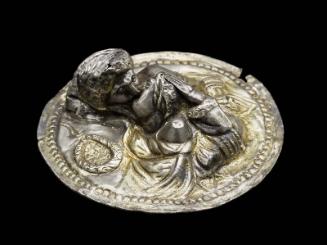 Round attachment with a man and a woman kissing