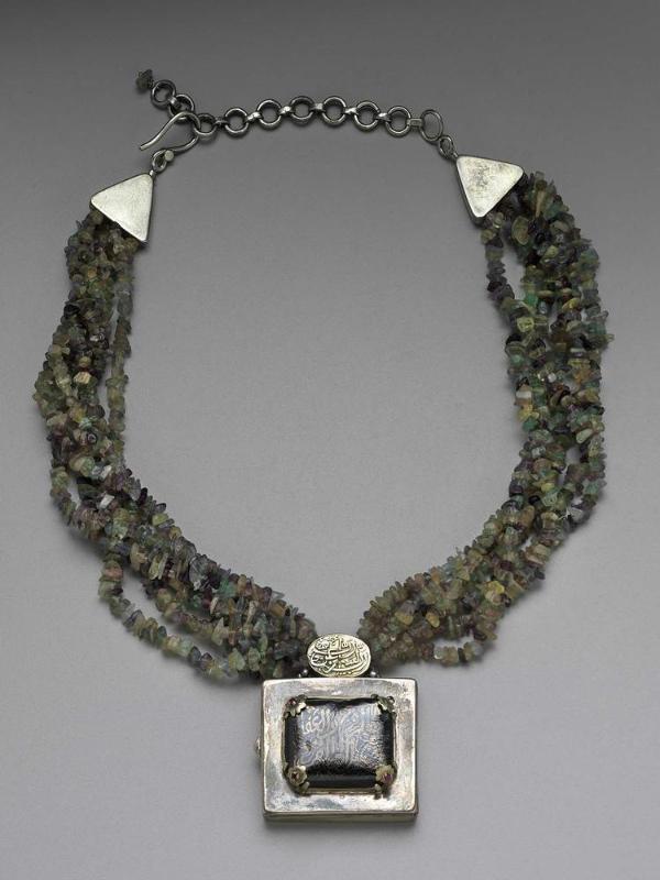 Necklace with an amuletic case pendant