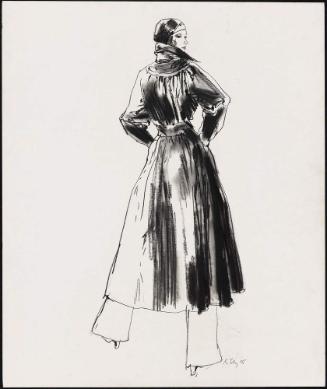 Young woman in long coat and slacks