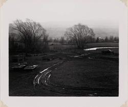 Untitled (Landscape with farm equipment)