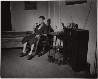 Man in Rocker with Pipe, South End