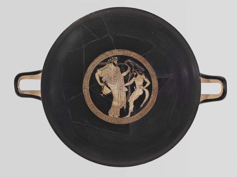 Drinking cup (kylix) with Dionysos and a satyr