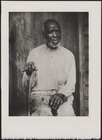 Seated Man with Cane