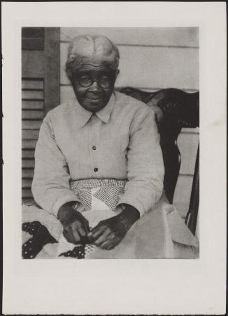 Woman Sewing Quilt