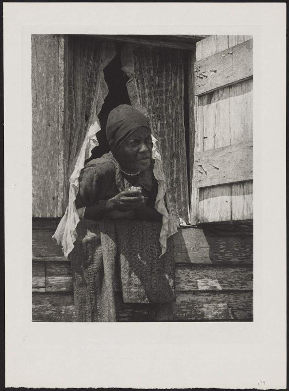 Woman Leaning Out Window