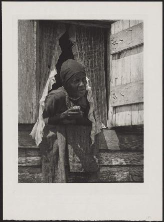 Woman Leaning Out Window