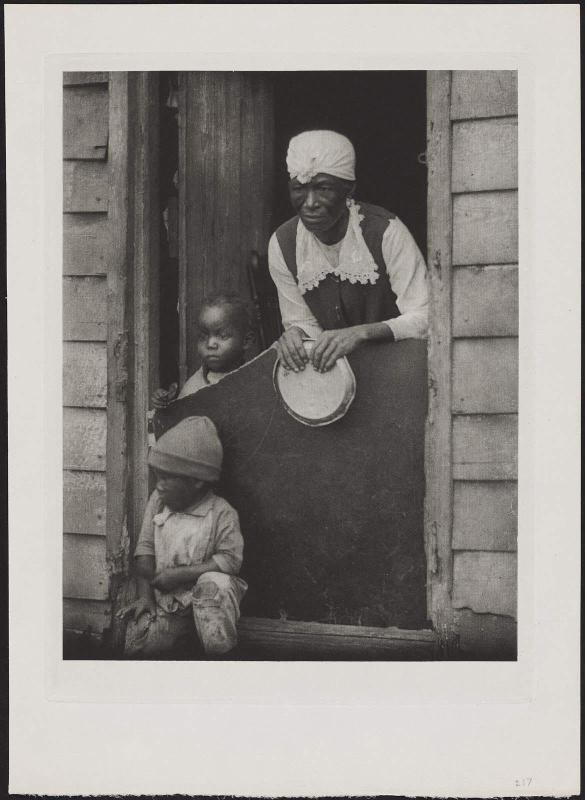 Woman and Two Children in Doorway