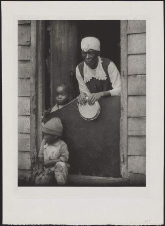Woman and Two Children in Doorway