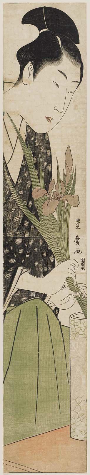 Young Man Arranging Iris in a Vase