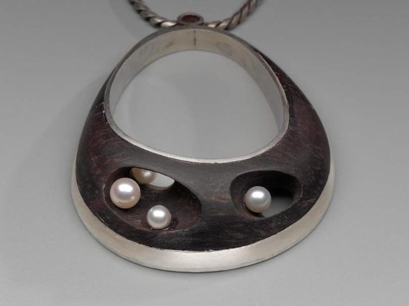 Pendant necklace with ebony inlay
