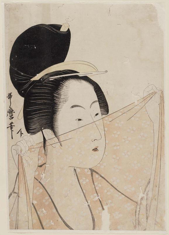 Woman Holding a Piece of Gauze Before Her Face