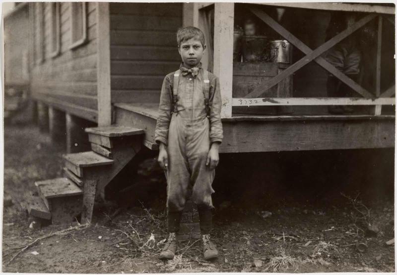 Little Boy in Front of Porch
