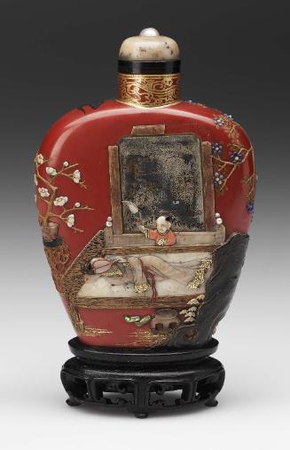 Red lacquer snuff bottle with applied semi-precious materials of a figure in a garden