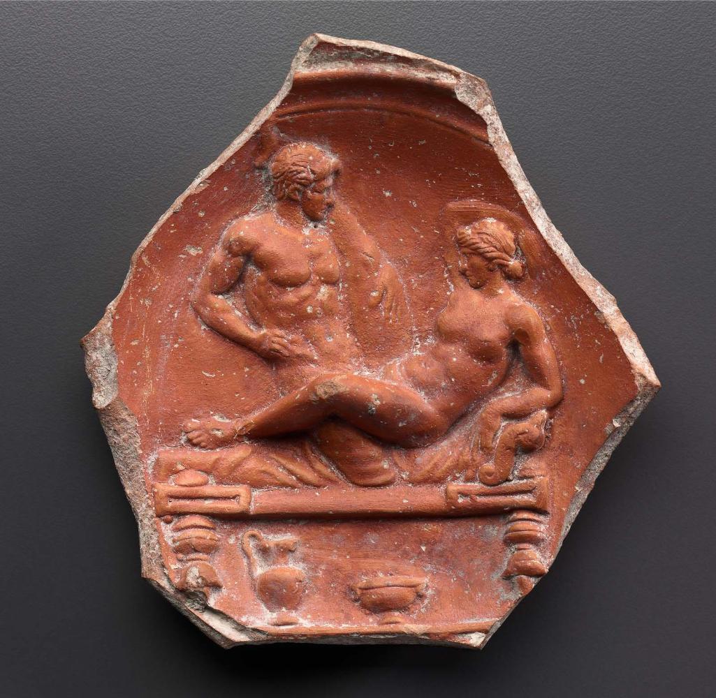 Fragment of a relief-decorated bowl with an erotic scene