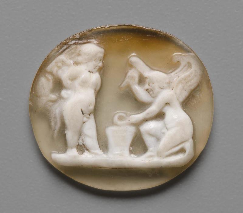 Cameo with two cupids making arms