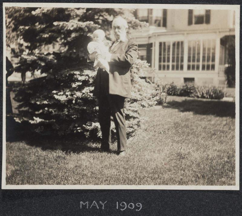 Emily held by her grandfather (Judge Frederick David Ely), Dedham, MA, May