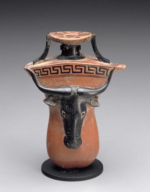 Oil flask (aryballos) in the shape of male genitals with a bull's head in relief