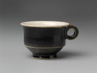 Small cup with ring-shaped handle
