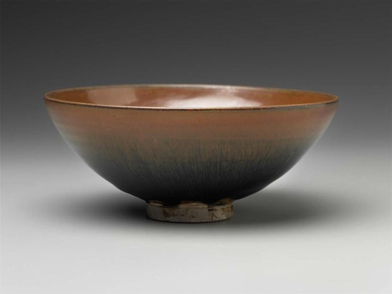 Tea bowl with dark brown glaze and russet glazed rim