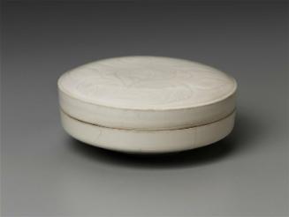 Box with carved peony design under ivory white glaze