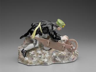 Mining figure with wheelbarrow