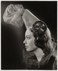Woman Modeling a Cannon Inspired Hat
