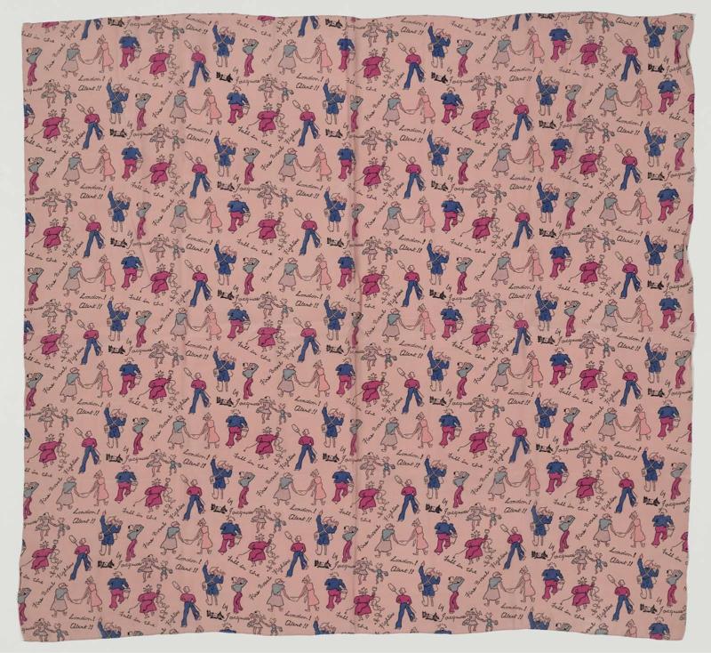 Woman's scarf: "London! Alert!!"