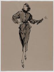 Female model in fitted suit carrying gloves 