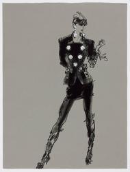 Female model in fitted black suit with big white floral buttons and boots 