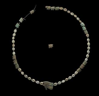 Cowrie shell and eye of Horus (wedjat) beads