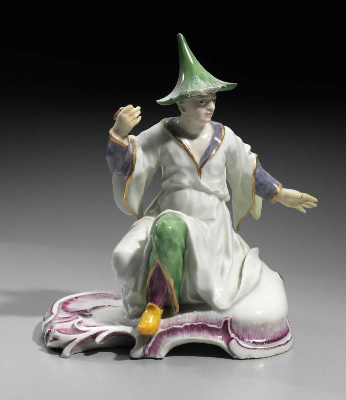 Figure of a seated man in Chinese costume