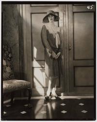Model with Hat in Front of Door