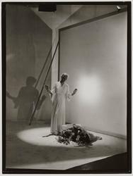 Madame Muth wearing Alix (Madame Gres) against white theatrical background
