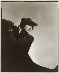 Model Wearing Hat and Jewelry