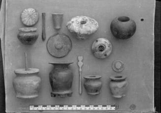 Kohl pot, mace head, etc. 14-2-144 (faience), 14-2-157 (wood), 14-1-4 (=MFA 20.1133) (slate?), …